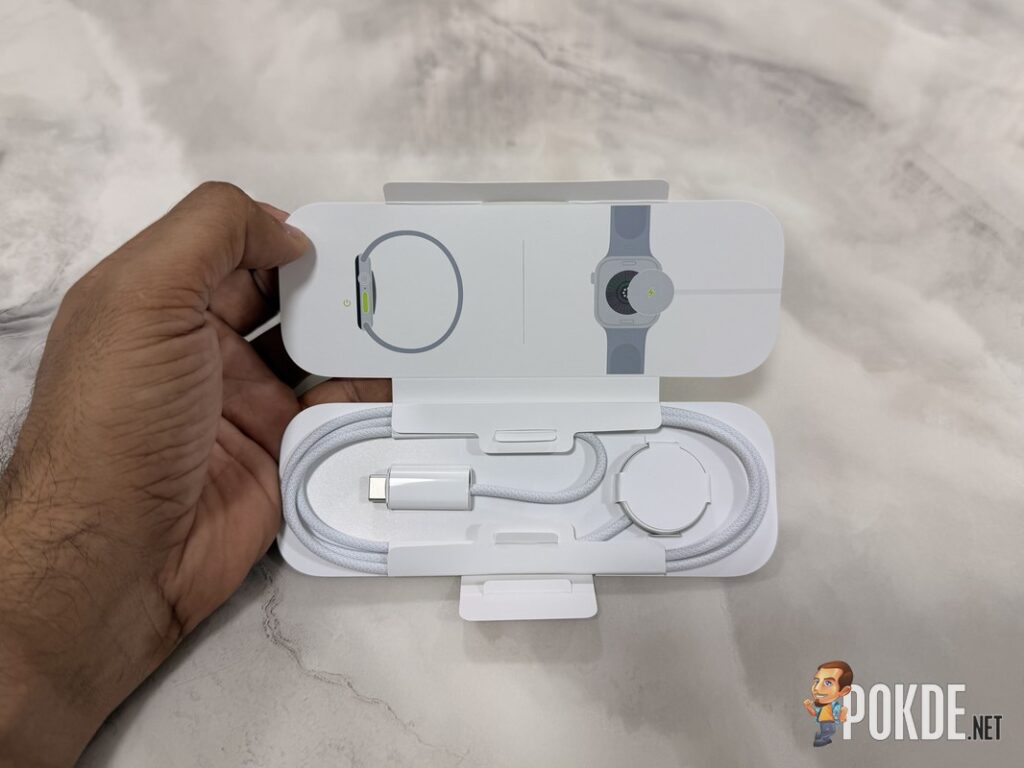 Apple Watch Series 12 Review - Health First, Finally Fun - 23 Apple Watch Series 12 charger tray with USB-C braided cable and charging puck
